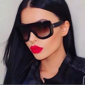 Black on black oversized sunglasses